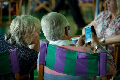 The Wimbledon Championships 2014
The All England Lawn Tennis & Croquet Club Wimbledon
Spectators look at the Wimbledon smartphone app in the Lawn Buffet
Day 12
Saturday 5th July 2014
Picture by: Dillon Bryden/AELTC